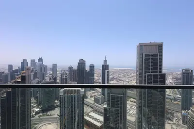 a view of a city from the top of a skyscraper at Top floor Grande 2BR Luxe Panoramic Sea View BohemianStyle in Dubai