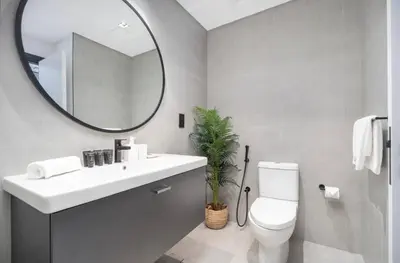 a bathroom with a sink and a mirror and a toilet at Gem in the heart of Business Bay - 15 Northside in Dubai