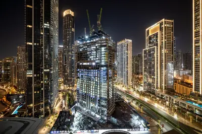 a city skyline at night with many tall buildings at Stylish 1BR Apartment near Burj Khalifa and Dubai Fountain, Downtown in Dubai