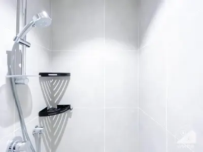a shower in a bathroom with a shower head at Chic New Studio at Studio One Marina in Dubai