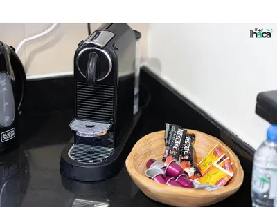 a basket of candy is next to a toaster at Boho Studio Beachfront Ain Sea View JBR Walk 1min in Dubai