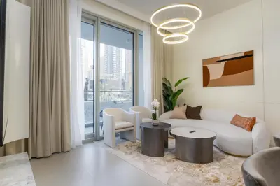 a living room with a couch and a table at 313 Downtown Luxury Living at it's Finest in Dubai