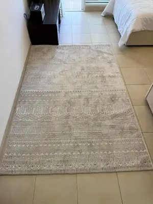 a bedroom with a rug on the floor at Luxury 1BR studio with Scenic view near Dubai mall in Dubai