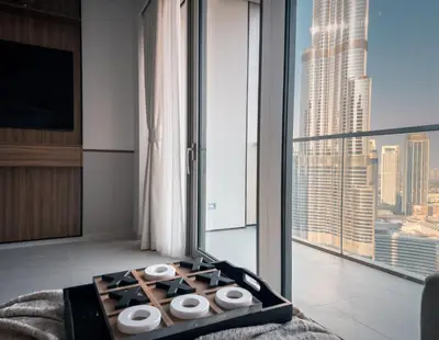 a hotel room with a view of a city at GRANDE SIGNATURE with a direct Burj Khalifa view and Private Fountain Show at high floor with DXB AIRPORT VIP Shuttle option for 6 guests in Dubai