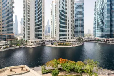 a view of a river in a city with tall buildings at Urban Studio Apartment in Goldcrest Views JLT in Dubai