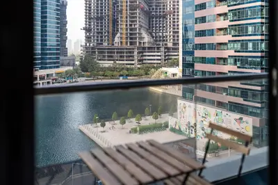 a view of a river in a city with buildings at Urban Studio Apartment in Goldcrest Views JLT in Dubai