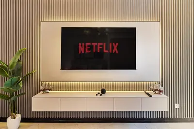 a sign on a wall with a netflix sign on it at Luxury JLT Studio Lake View Metro Pool Access in Dubai