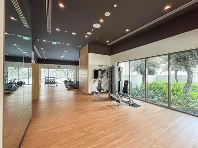 a gym with treadmills and exercise equipment in a building at Premium Home in Creek Beach with Lagoon Access in Dubai