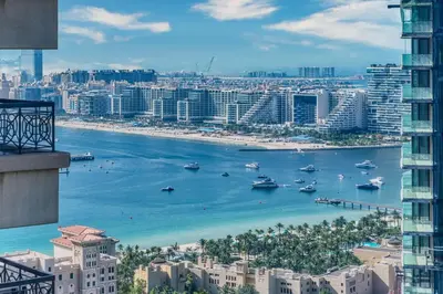 a view of a city with boats in the water at Chic Marina Arcade Apartment Minutes to Beach in Dubai