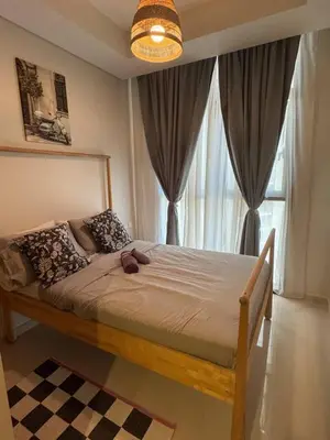 a bed in a bedroom with a large window at Samani vacation homes 3108 canal view in Dubai