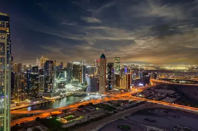 a city skyline at night with traffic at Samani vacation homes 3108 canal view in Dubai