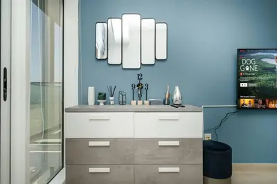 a bathroom with a sink and a mirror at Spacious JVC Studio Luxury Escape in Dubai