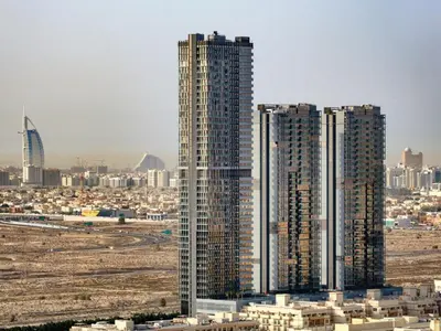 a group of tall buildings in a city at Spacious JVC Studio Luxury Escape in Dubai