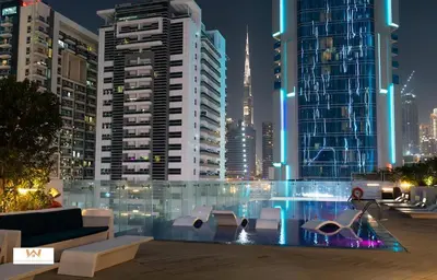 a view of a city at night with buildings at Elevated Living Studio Facing the Burj in Dubai