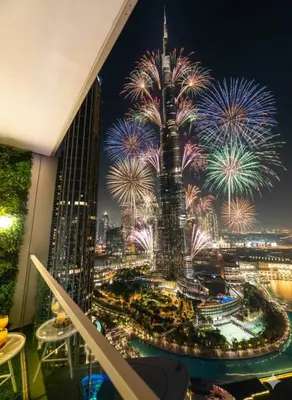 a view of the burj khalifa with fireworks at Sky-High Burj Khalifa and Fountain Views in Dubai