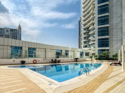 a swimming pool in the middle of a building at The Smart Concierge - Dorra Bay in Dubai