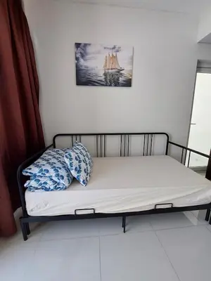 a bed with two pillows on it in a room at Damac Hills 2- Relaxing 3BR townhouse - Homeyvillas in Dubai
