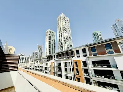 a row of buildings in a city with tall buildings at Vserve - Peaceful 1 BR Getaway in Vibrant JVC in Dubai