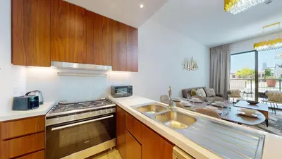 a kitchen with a sink and a stove at La Sirene 2 - Magnificient Two Bedroom in La Mer in Dubai