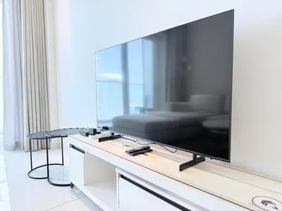 a large flat screen tv sitting on top of a table at Premium Stay - Damac Heights 1BR in Dubai