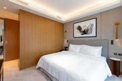 a bedroom with a large white bed in a room at Address Residences, Dubai Opera 1, Downtown - Mint Stay in Dubai