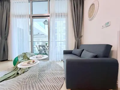 a living room with a couch and a table at LivWithUs-Studio in One BR Setup, Dubai Marina in Dubai
