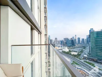 an apartment balcony with a view of the city at Luxurious Burj Crown 2BR Apartment with Balcony in Dubai