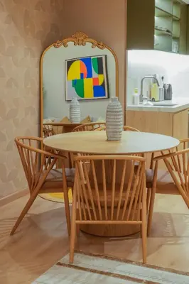 a dining room table and chairs with a mirror at 2 bedroom Apartment Dubai Marina in Dubai