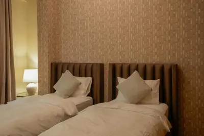 two beds with white sheets and pillows in a room at 2 bedroom Apartment Dubai Marina in Dubai
