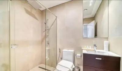 a bathroom with a shower and a toilet and a sink at Dubai Marina Sea View hotel Apartment in Dubai