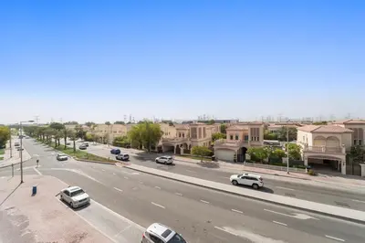 a view of a street with cars parked on the road at FIRST CLASS Studio Contemporary Living in JVT in Dubai