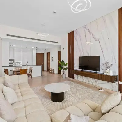a living room with a couch and a table at Luxury Canal View-2BR Maid's Room in CF 2, Al Wasl in Dubai