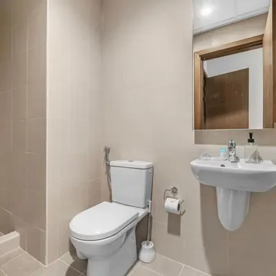 a bathroom with a toilet and a sink at Luxury Canal View-2BR Maid's Room in CF 2, Al Wasl in Dubai
