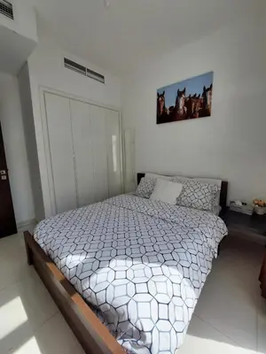 a bedroom with a large bed in a room at Damac Hills 2- 3BR Townhouse - Homeyvillas in Dubai