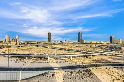 a highway with a city in the background at FIRST CLASS Studio Unwind in Style in Dubai