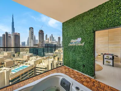 a bathroom with a view of a city at Exclusive 1BD with Burj View & Private Jacuzzi in Dubai