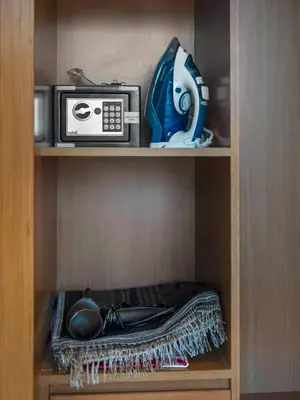 a cabinet with a microwave and a radio in it at Exclusive 1BD with Burj View & Private Jacuzzi in Dubai