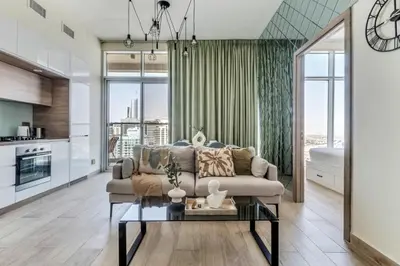 a living room with a couch and a table at GuestReady - Luxe waterfront stay in Dubai Marina in Dubai