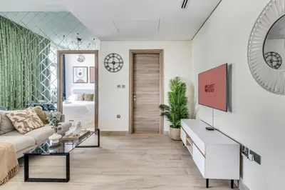 a living room with a couch and a table at GuestReady - Luxe waterfront stay in Dubai Marina in Dubai