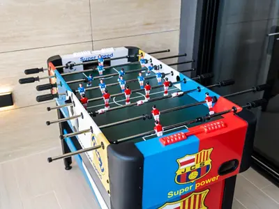 a foosball game in a gymnasium at Chic 1BR Burj Khalifa Views Private Jacuzzi in Dubai
