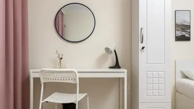a white desk with a chair and a mirror at The Manchester JBR Marina Apartment Private Room with shared washroom in Dubai