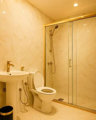 a bathroom with a shower and a toilet and a sink at The Manchester JBR Marina Apartment Private Room with shared washroom in Dubai