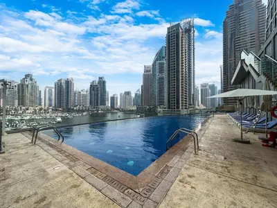 a swimming pool in the middle of a city at 44th Floor Home at Cayan Tower with Panoramic Views in Dubai