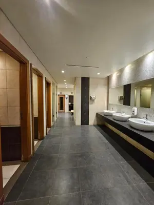 a bathroom with four sinks and a row of mirrors at Marina Residence 6 - Luxurious Two Bedroom and Maid's - Lake and Sea View in Dubai