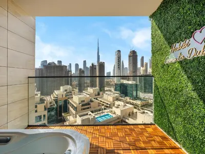 a bathroom with a window with a view of a city at Trendy 1BR Private Jacuzzi Burj Khalifa View in Dubai