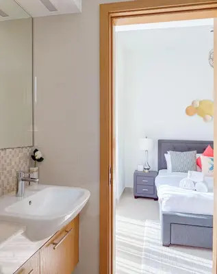 a bathroom with a sink and a bed at Burj Khalifa Panoramic view-1BR,4 guests, Downtown in Dubai