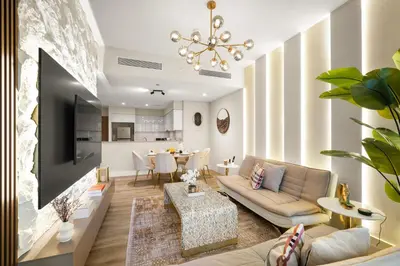 a living room with a couch and a table at Gogoto3 High Floor Burj Khalifa NYE Fireworks View PS5 in Dubai