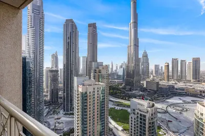 a view of a city skyline with tall buildings at 29 Boulevard - Luxury 2BR Apartment with Burj Khalifa & Fountain View in Dubai