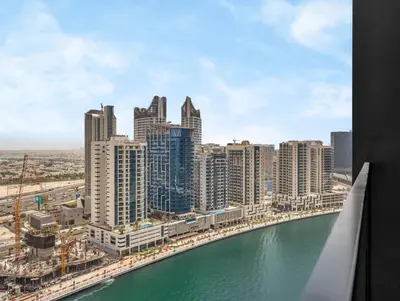 a view of a city with a river and buildings at Modern Studio Private Jacuzzi Canal View in Dubai
