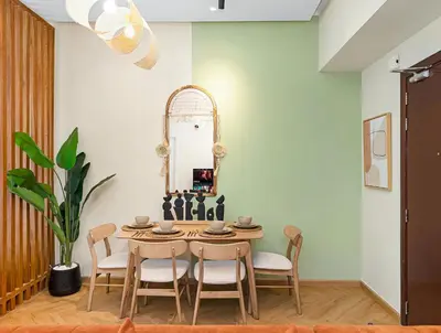 a dining room with a table and chairs and a mirror at Stunning Newly Furnished Elegant LUX Apartment in Dubai